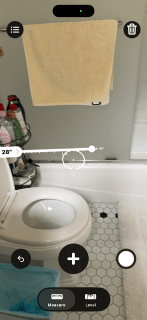 Before: the white subway tile on the bathroom wall