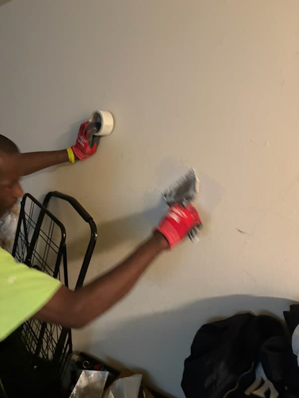 During: scribing the bedroom door slab to its opening