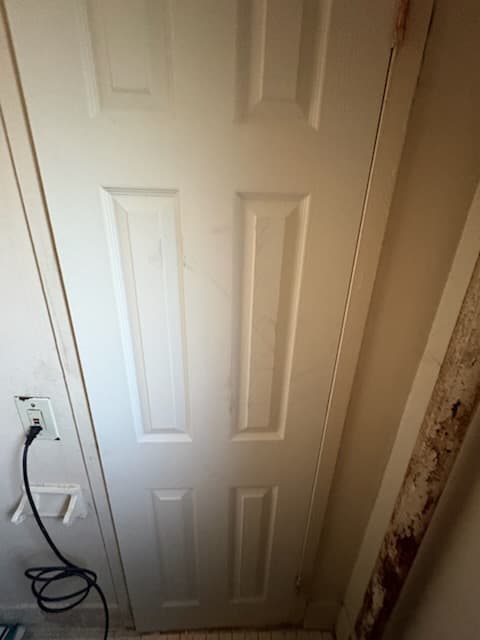 After: the new hallway door and trim in semi-gloss white