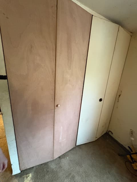 During: fitting a door slab in its opening