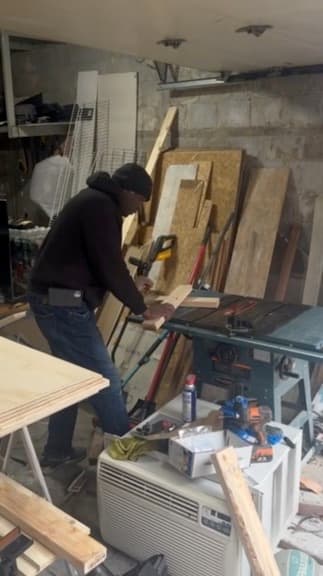 During: the floating shelf being set into the slat paneling
